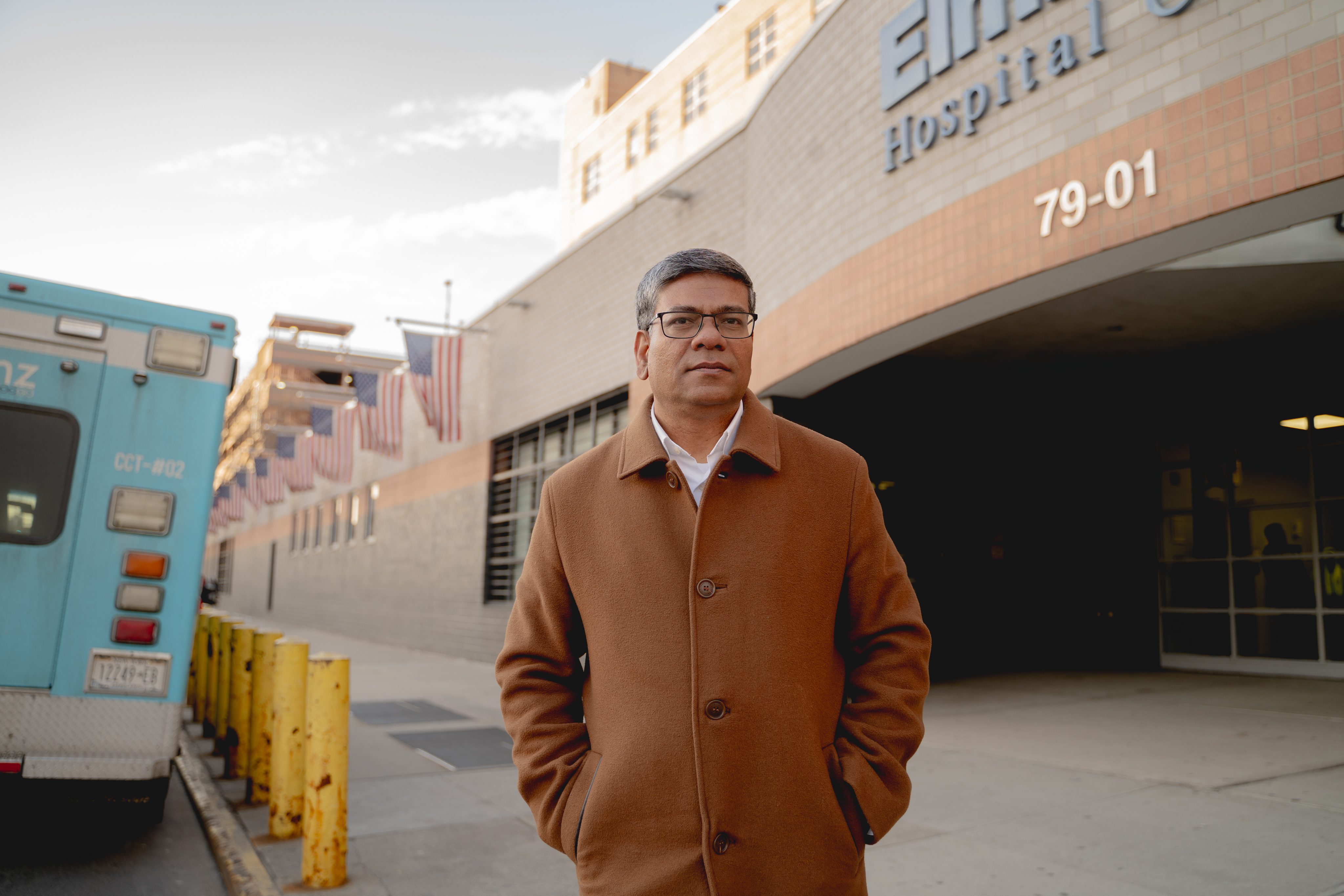 Shamsul Haque in front of a public institutional building in the evening